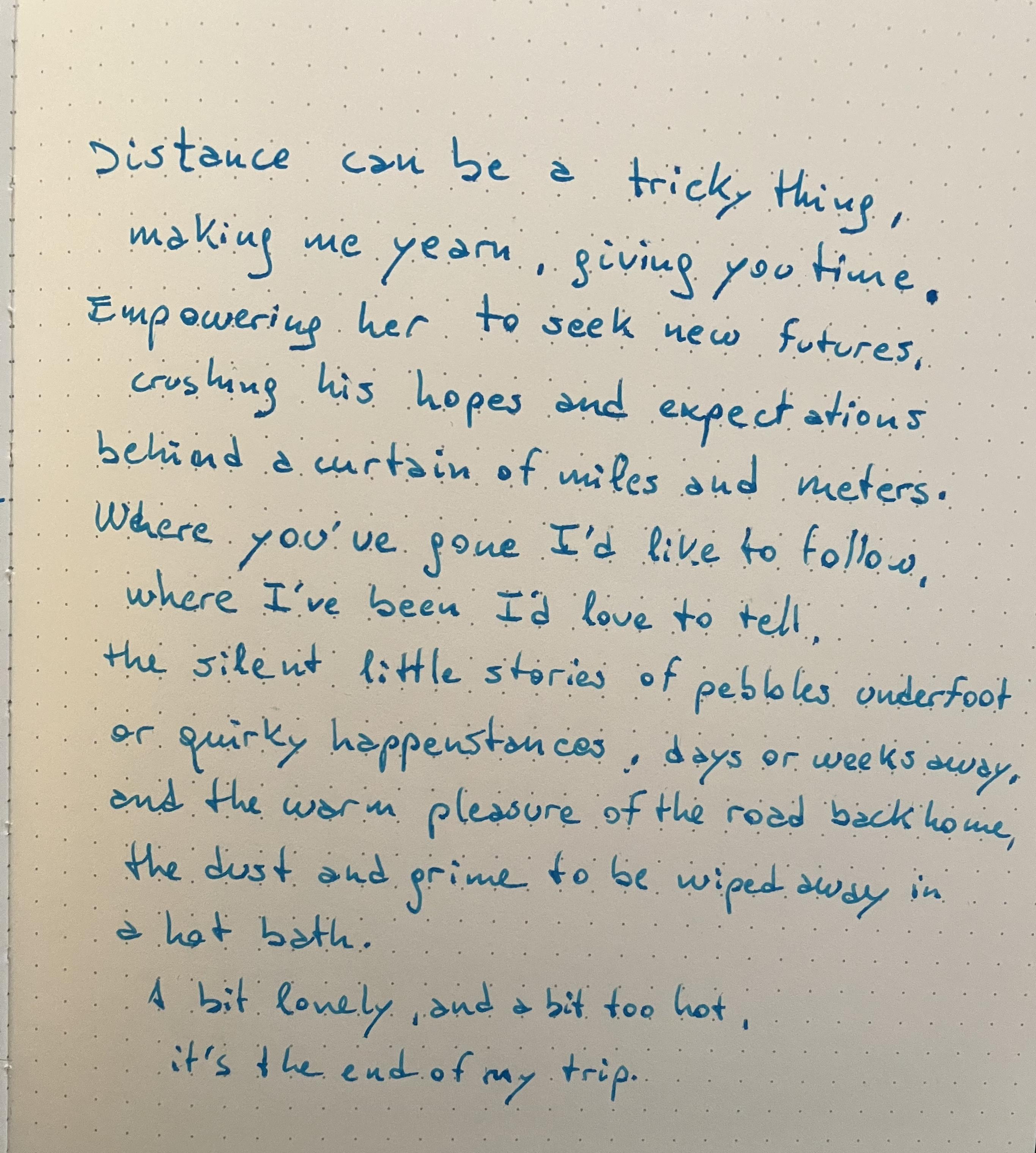 A notebook page with the text of the post, written in blue ink with a fountain pen